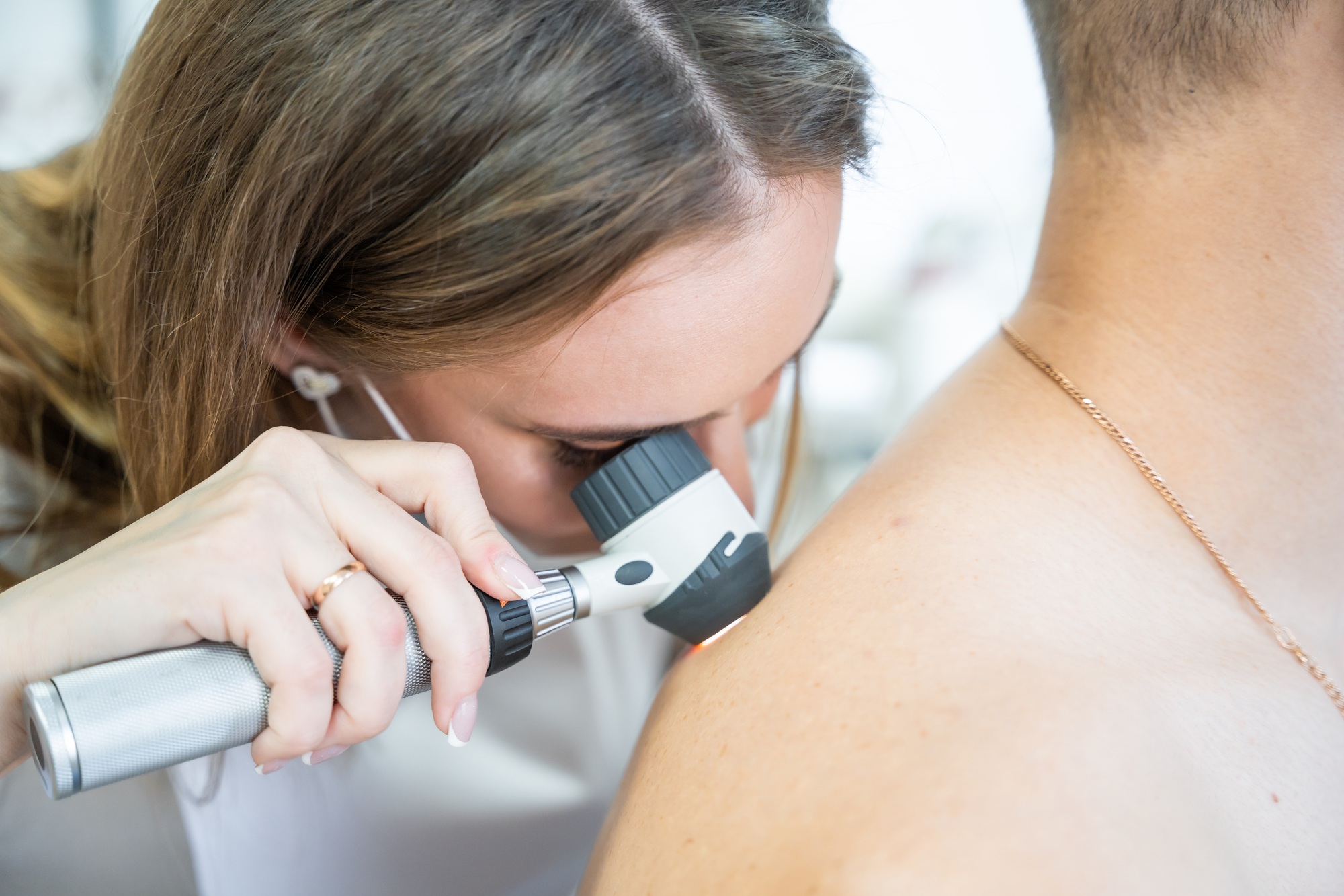 doctor-dermatologist-examines-skin-of-patient-dermatoscopy-prevention-of-melanoma-skin-cancer-1-1.jpg